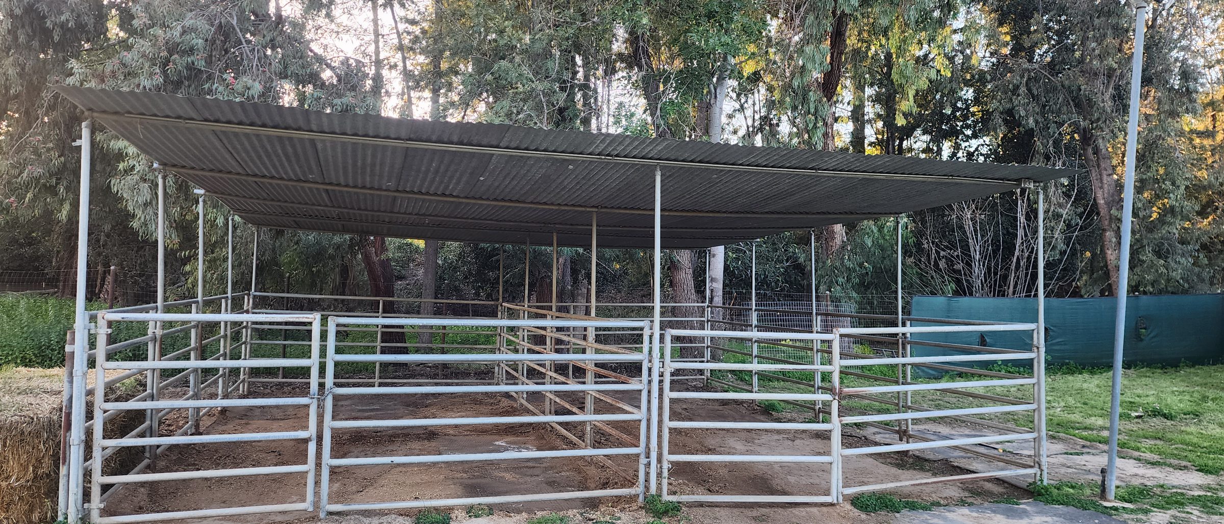 Covered pipe stalls and turnout on a Southern California equestrian property